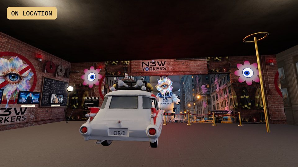 A firehouse in Tribeca with a white ambulance and a giant marshmallow with an eye flower for a head coming up the avenue