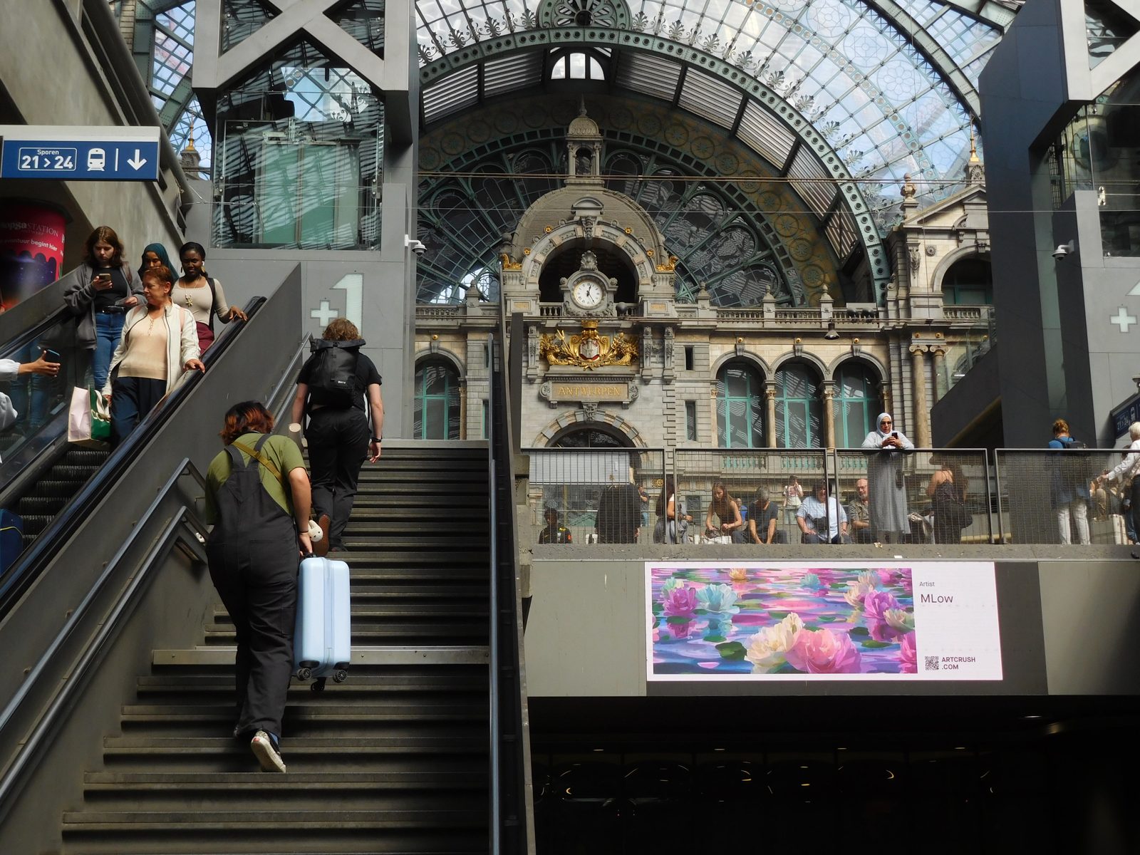 Endless Peonies on a digital screen inside Antwerp Central Station