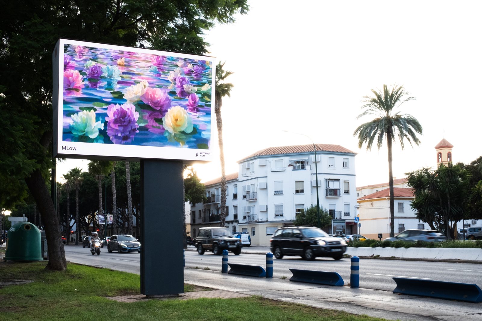 Endless Peonies on a roadside digital screen under palm trees in Malaga